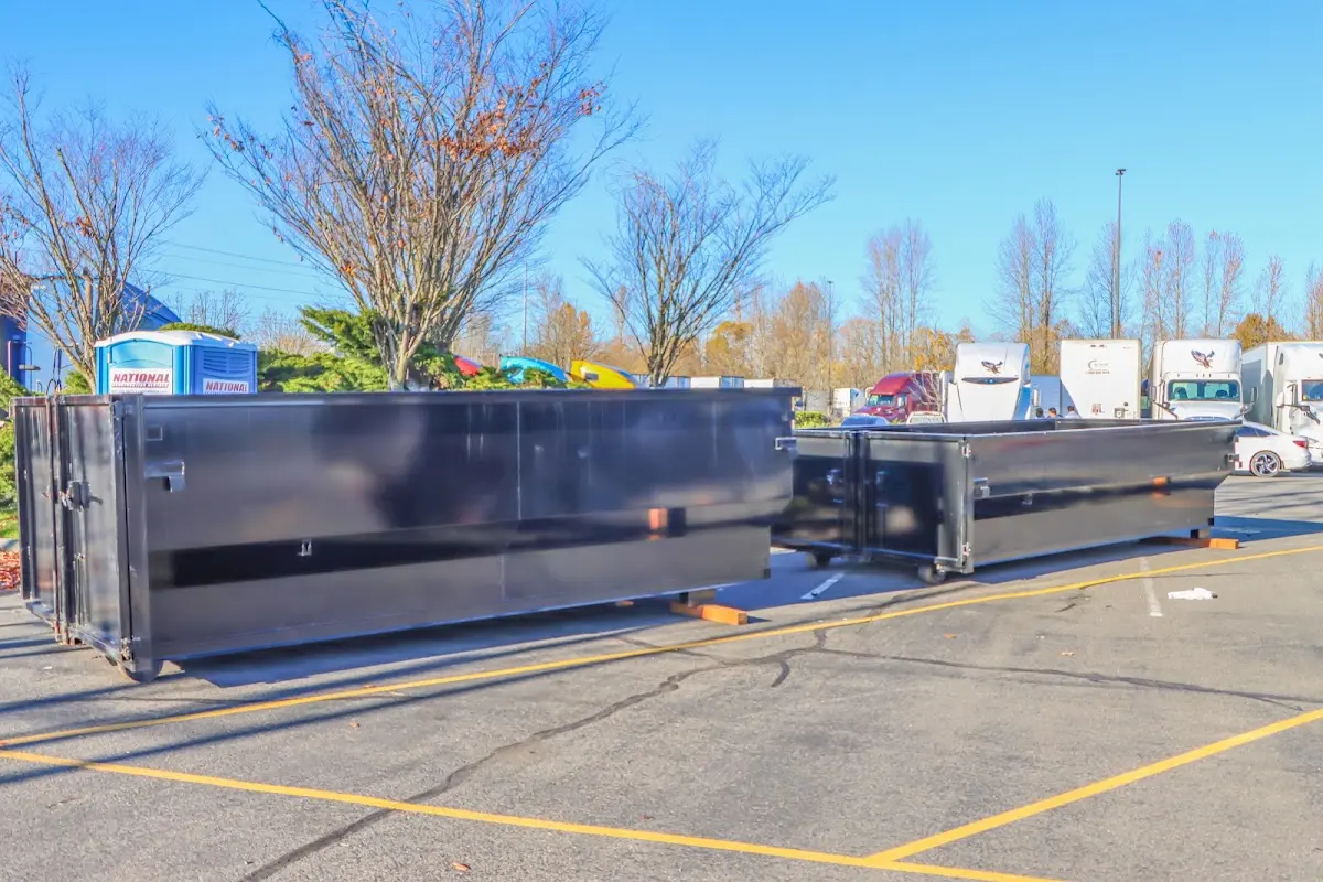 Professional dumpster rental service with roll-off container on residential driveway in Atascadero